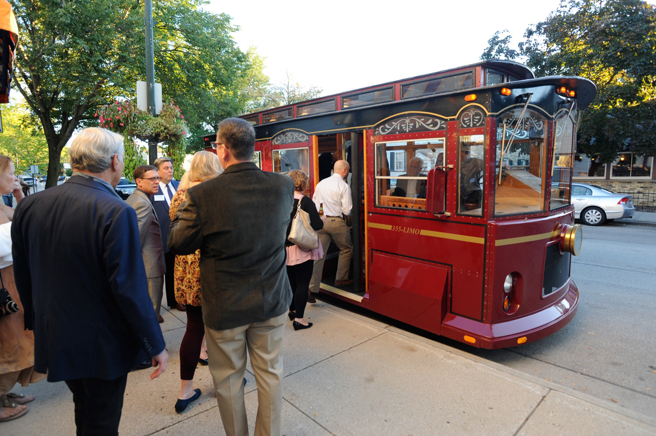 Guests board the trolley to the museums